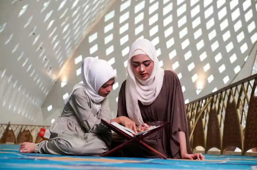 Open Quran with Arabic calligraphy and Tajweed verses