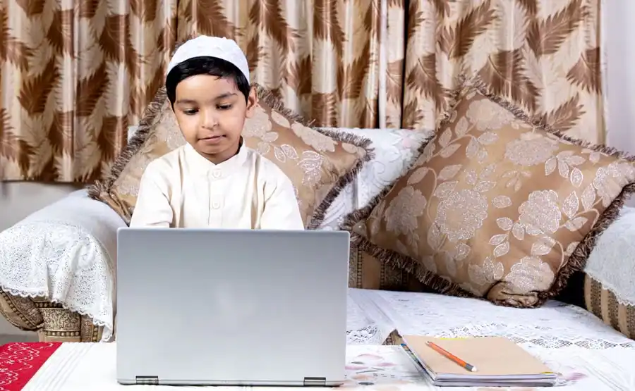 Open Quran on a wooden stand during Quran memorization